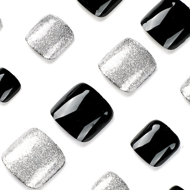 Artful toenail art with glitter and black design Kalsten