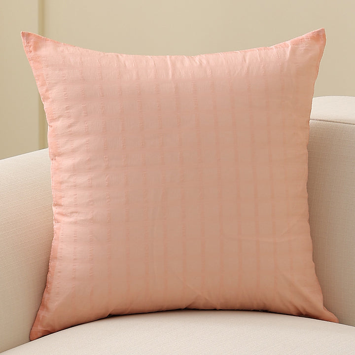Square decorative cushion with delicate mother-of-pearl look and fine micro tuft structure