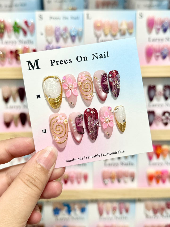 Artistic Press-On Nail Set with Floral and Green Accents