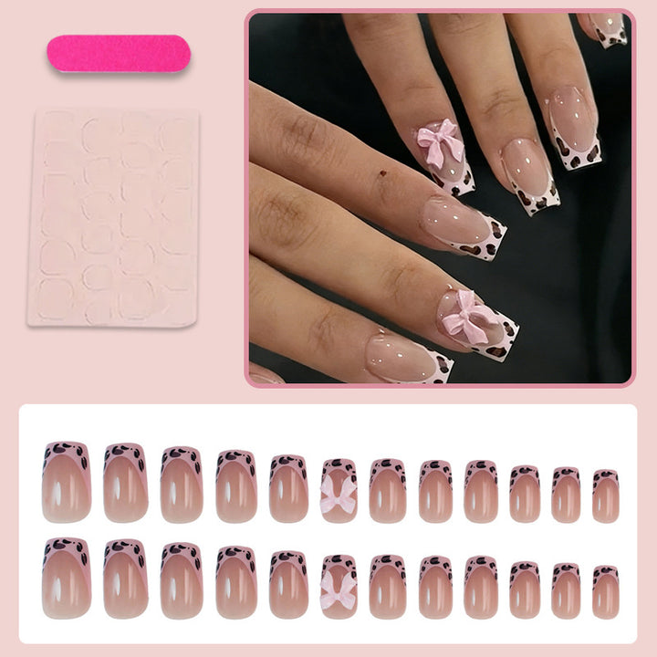 Acrylic nail set with playful bows and modern accents Kalsten