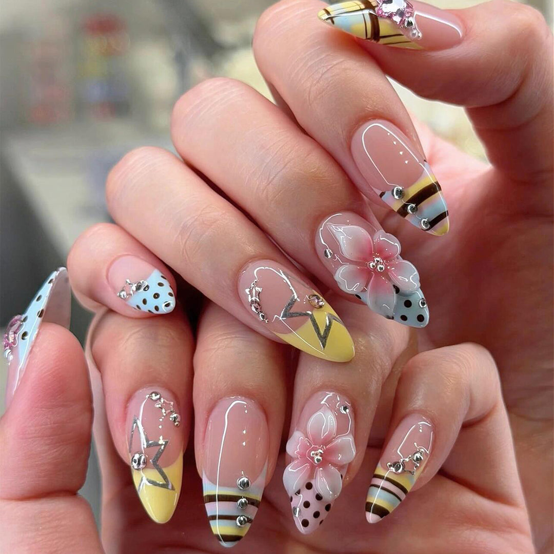 Creative nail designs with floral accents and glitter Kalsten