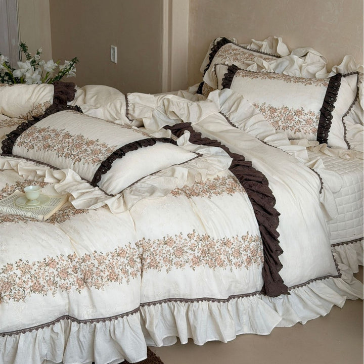Vintage-inspired country house bedding set with ruffles and floral ribbon embroidery