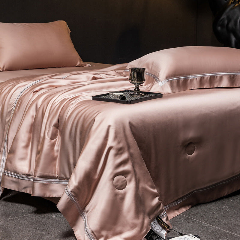 Luxurious satin bed set with silk-like surface and fine decorative stitching