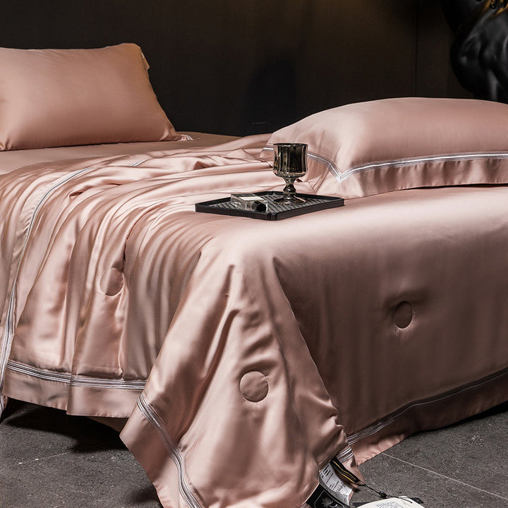 Luxurious satin bed set with silk-like surface and fine decorative stitching