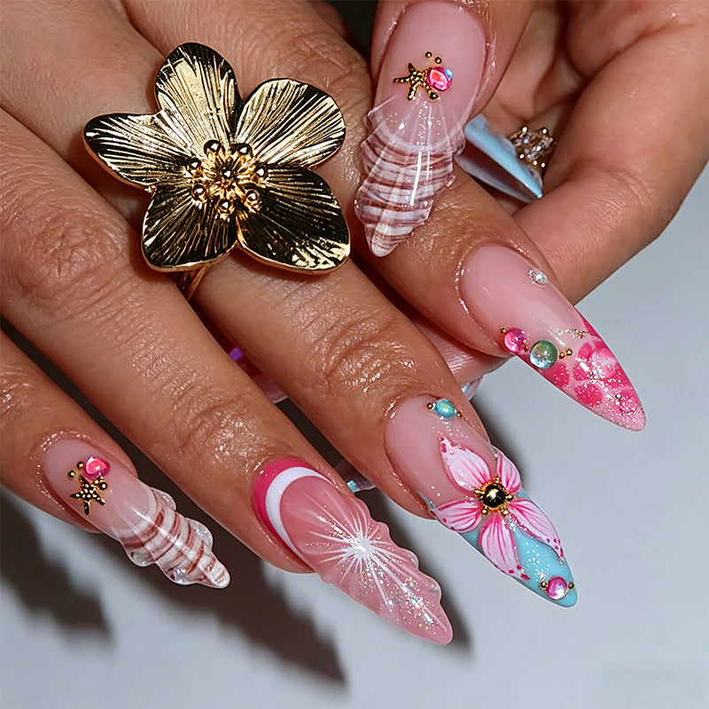 Artificial nail set with glamorous floral designs and creative glitter accents Kalsten