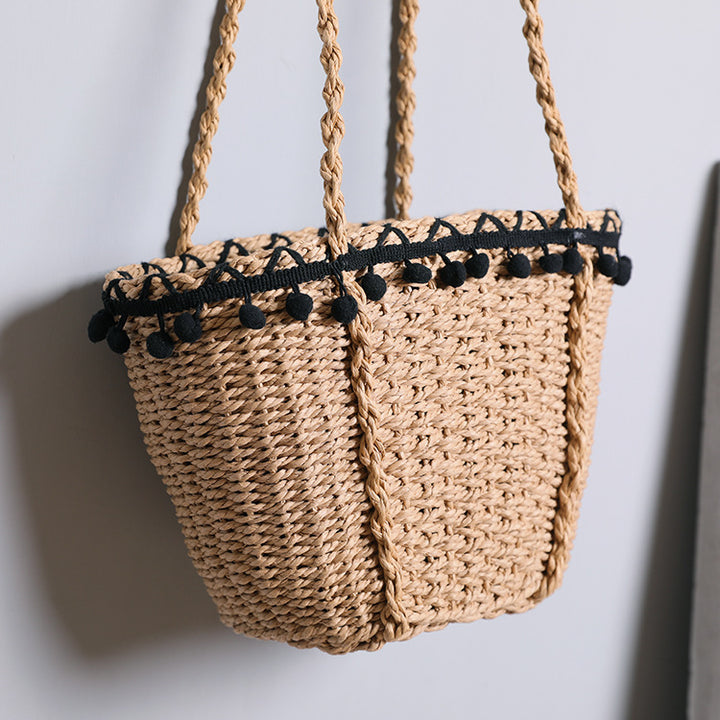 Delicate beach bag with pompons Kalsten