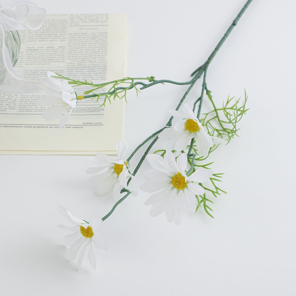 Artificial flower branch with bright blooms and delicate leaves