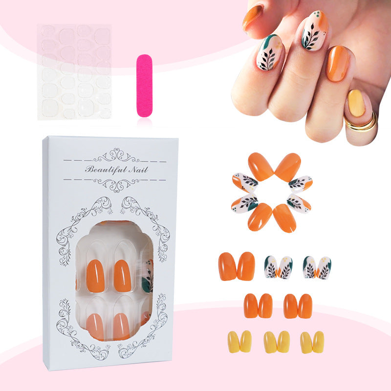 Artificial nail set with floral patterns and elegant glitter accents Kalsten