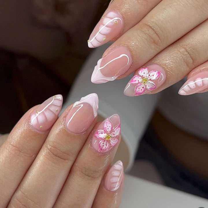 Artful Nail Extensions with Floral Design and Glitter Accents Kalsten