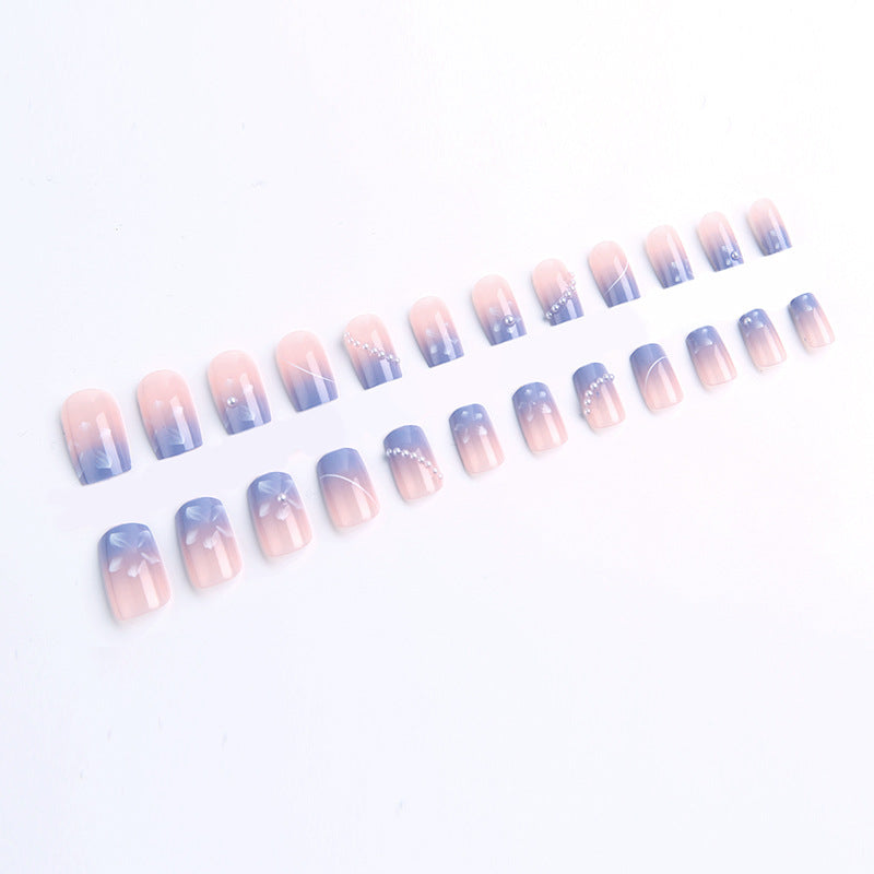 Nail set with elegant floral accents and glitter embellishments Kalsten