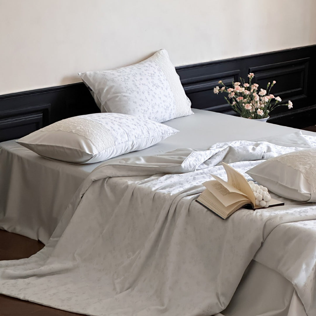 Luxurious satin bedding set with lace appliqué and jacquard pattern