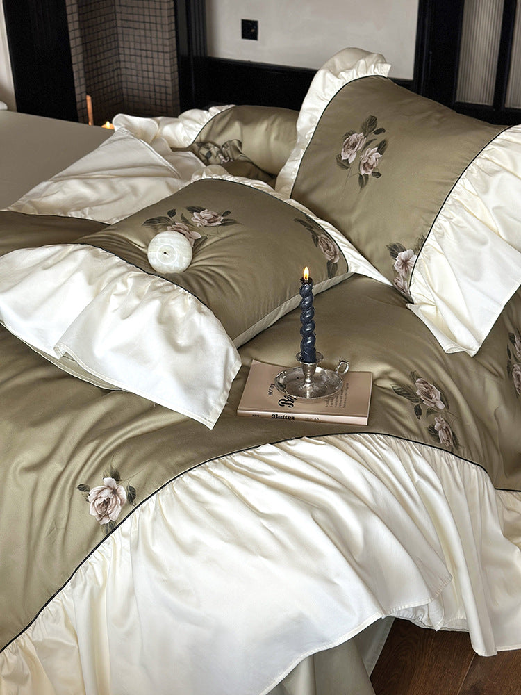 Luxurious satin bedding set with floral embroidery and frills
