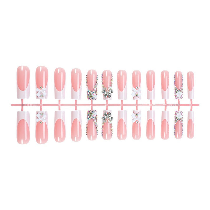 Artificial nail set with luxurious decorations and glitter accents Kalsten