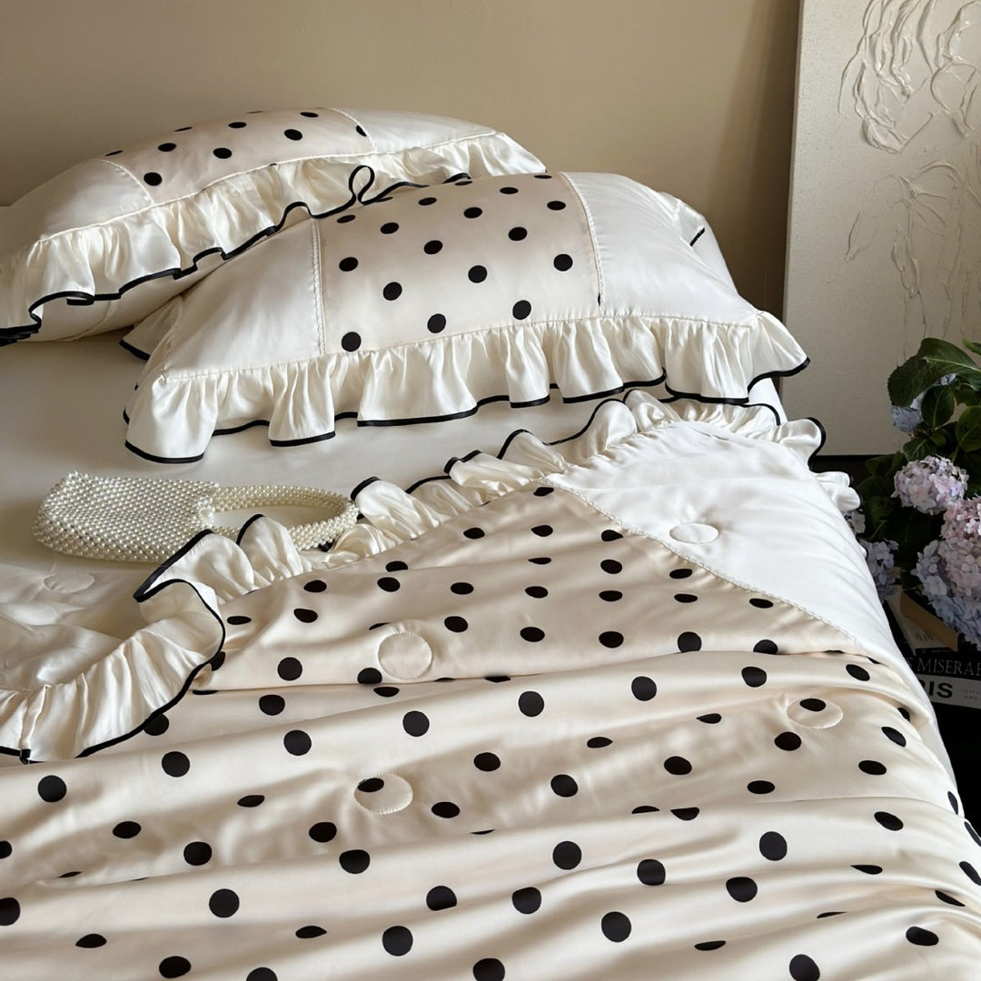 Elegant satin bedding set with polka dot pattern, ruffle and contrasting edge piping