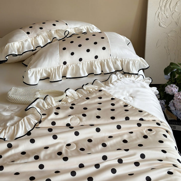 Elegant satin bedding set with polka dot pattern, ruffle and contrasting edge piping