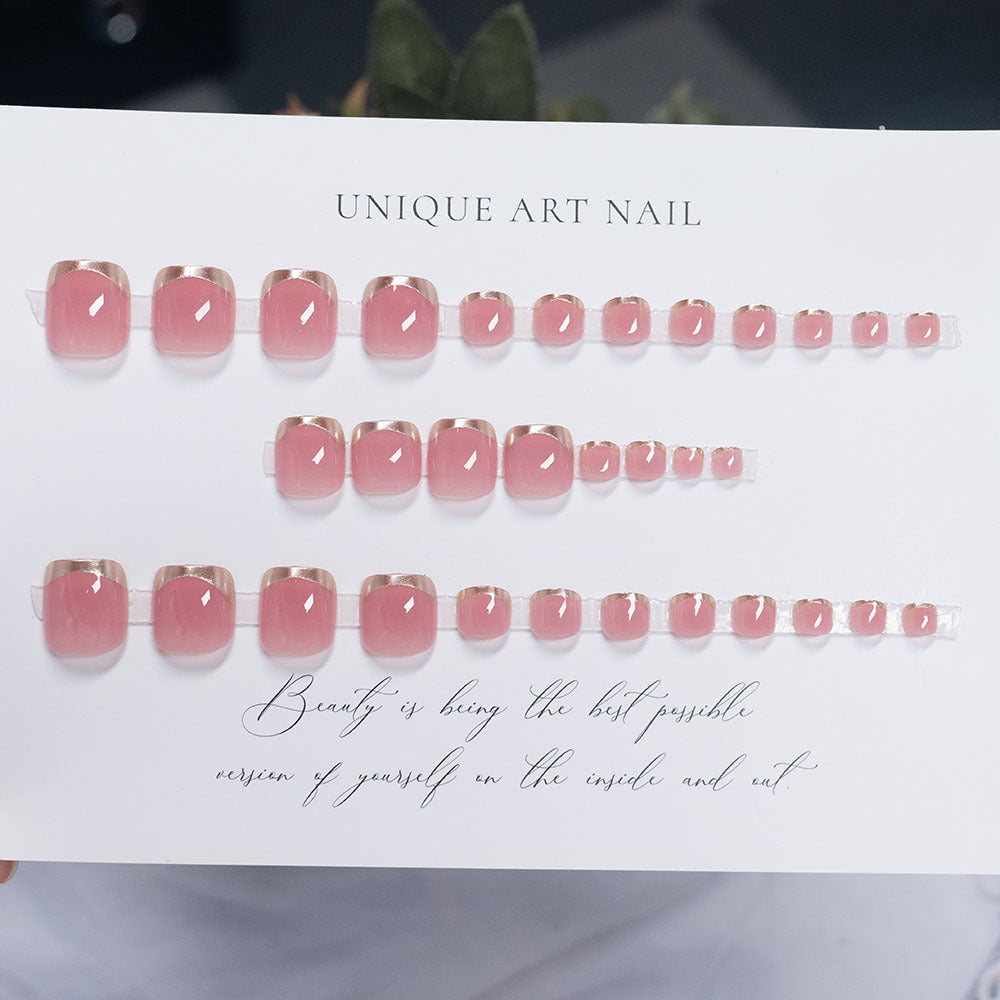 Press-On Nail Art with Elegant Gold Accents
