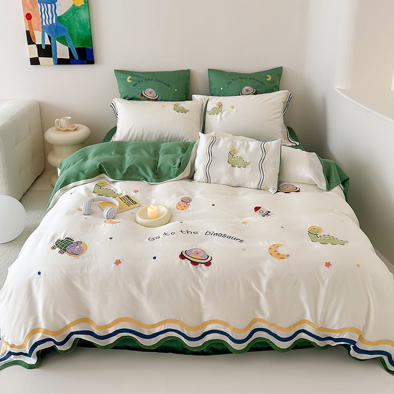 Children's bedding set with embroidered doll appliqués, ruffle and cuddle pillow