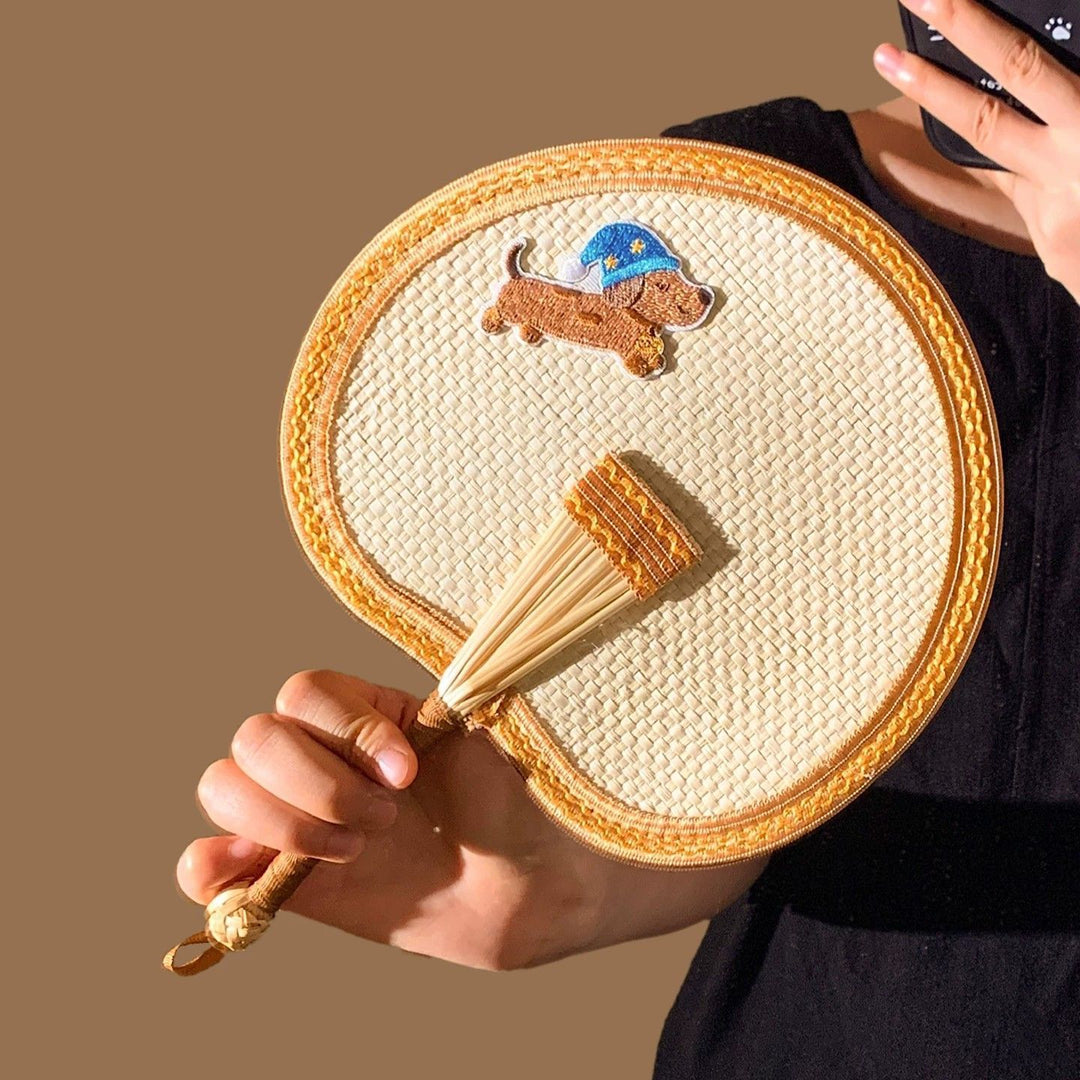 Handcrafted fan with playful dog motif Kalsten