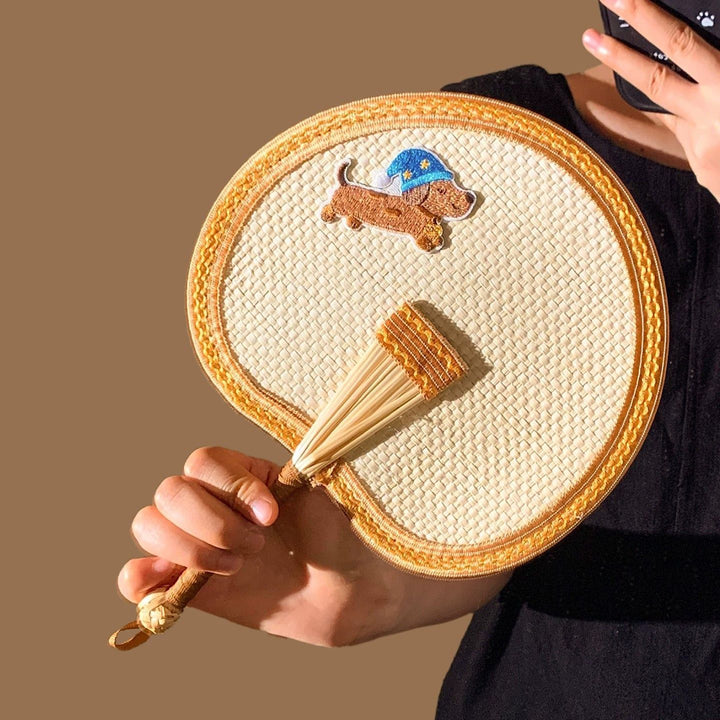 Handcrafted fan with playful dog motif Kalsten