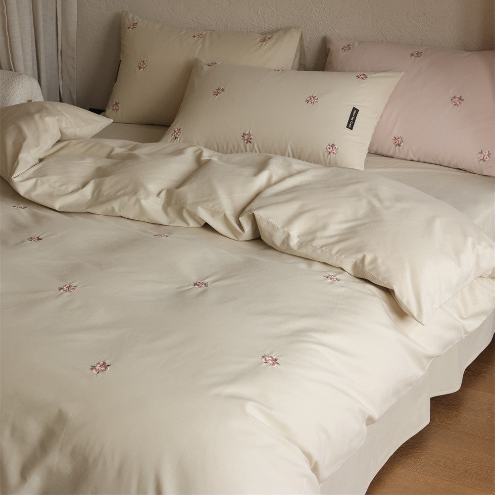 Embroidered cotton satin bedding set with subtle floral embroidery