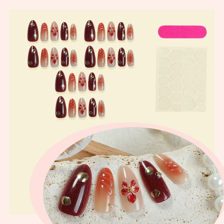 Acrylic nail set with elegant floral design and shimmering accents Kalsten