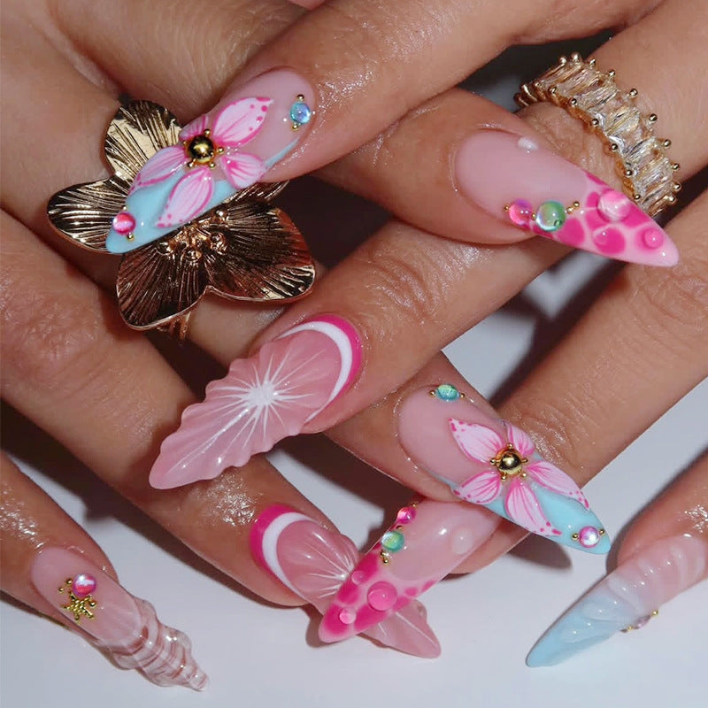 Creative nail art set with floral designs and decorative accents Kalsten