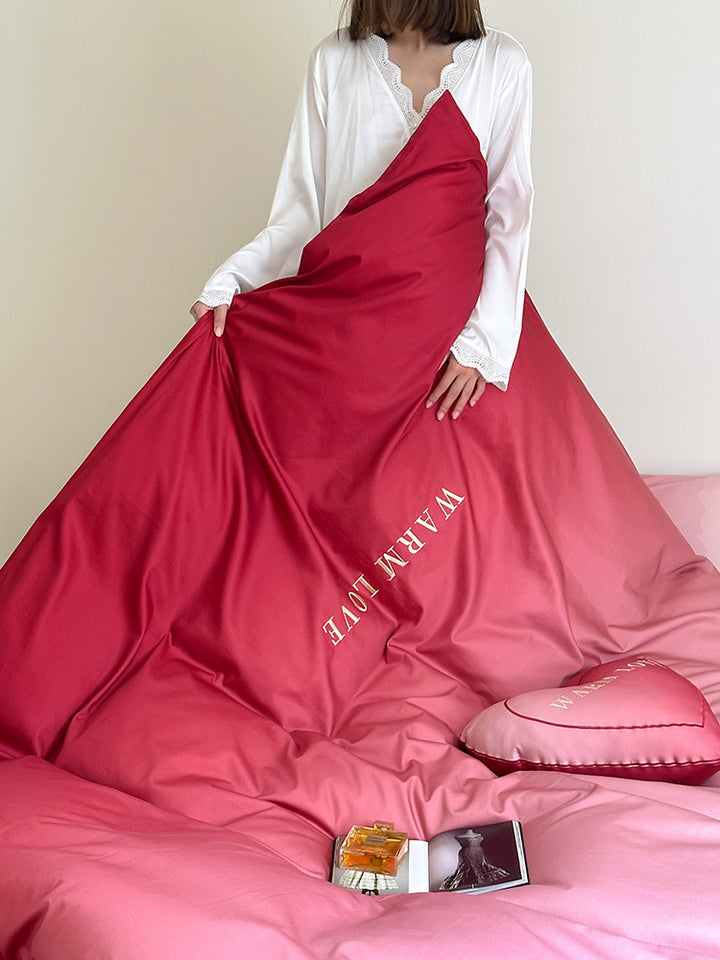 Luxurious satin bedding set with heart pillow and reversible function