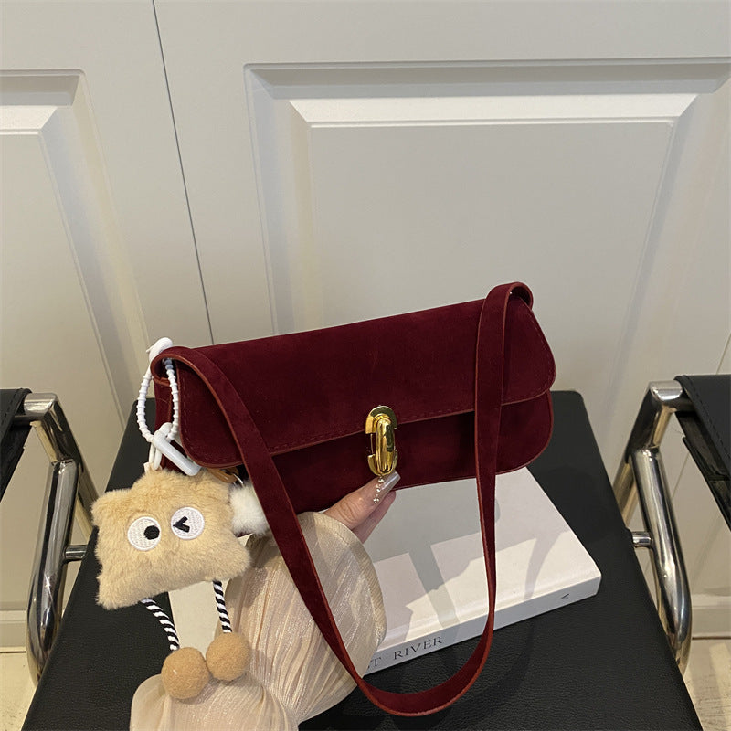 Elegant Suede Handbag with Playful Keychain