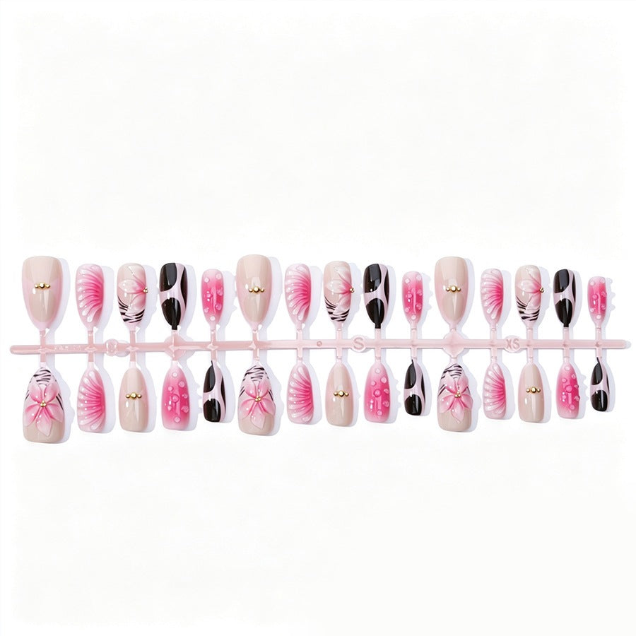 Acrylic nail set with filigree flower and glitter accents Kalsten