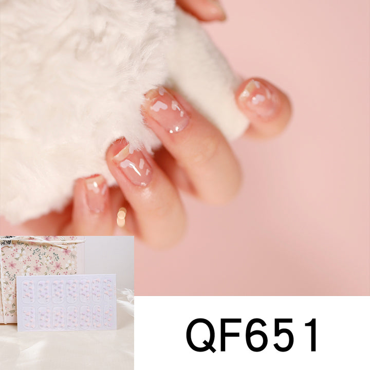 Artificial nail art with heart-shaped designs and soft color gradients Kalsten