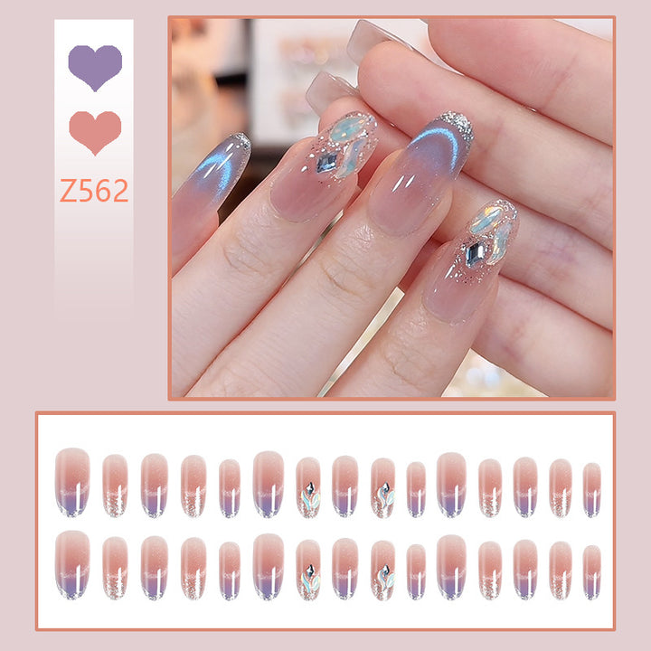 Acrylic nail set with elegant glitter effect and beautified embellishments Kalsten