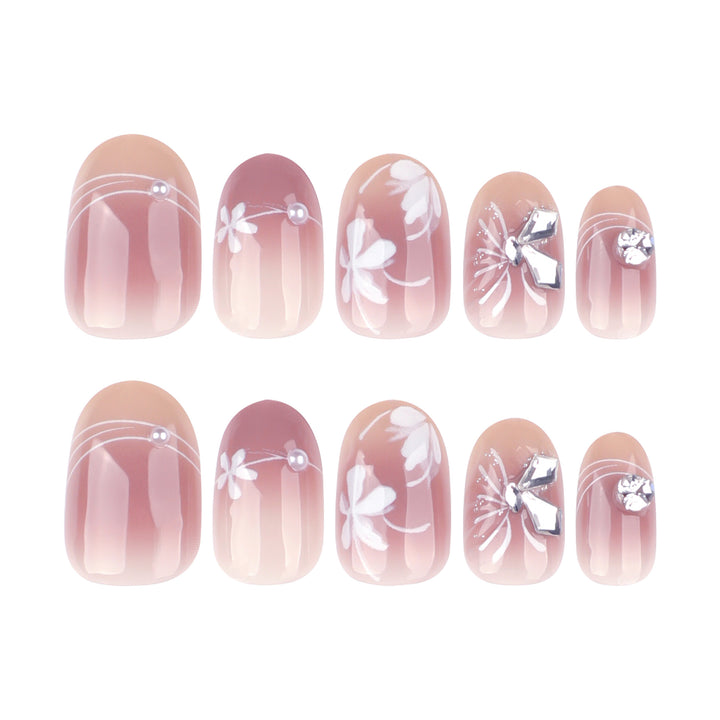 Artful nail design with floral pattern and glitter accents Kalsten