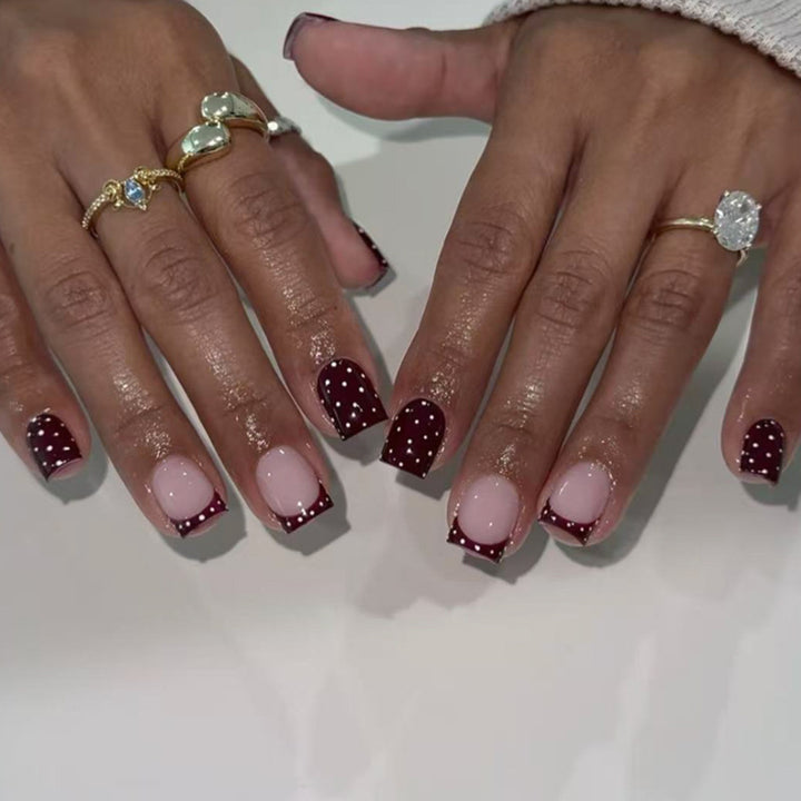 Artful nail art with elegant polka dot design Kalsten