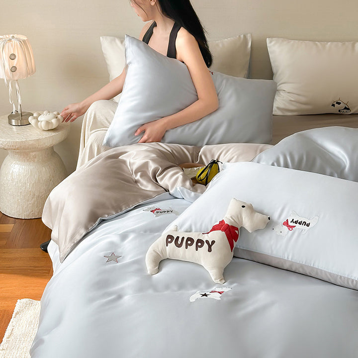 Luxurious satin bedding set with embroidered cherry motifs, reversible function and plush bunny pillow
