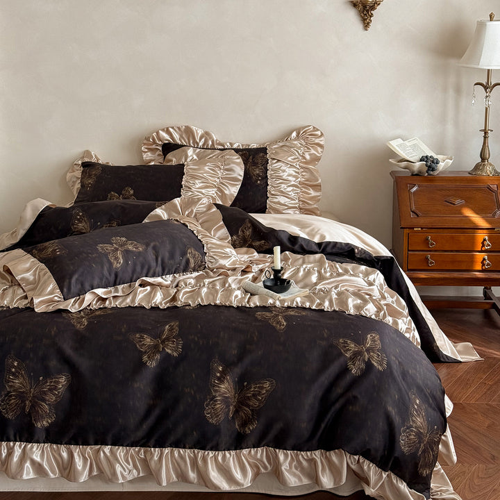 Luxurious satin bedding set with lush ruffles and butterfly print