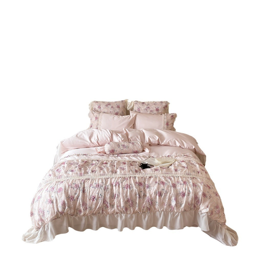Romantic quilted bedding set with ruffles and floral pattern