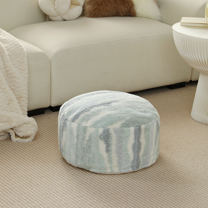 Round seating pouf made of teddy fleece with soft textured cover