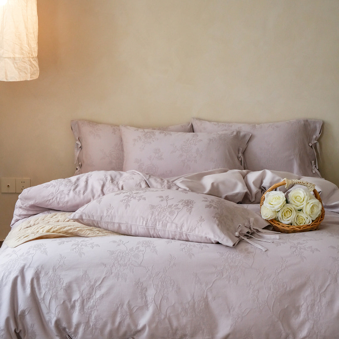 Fine cotton bedding set with jacquard floral pattern and side decorative ribbons