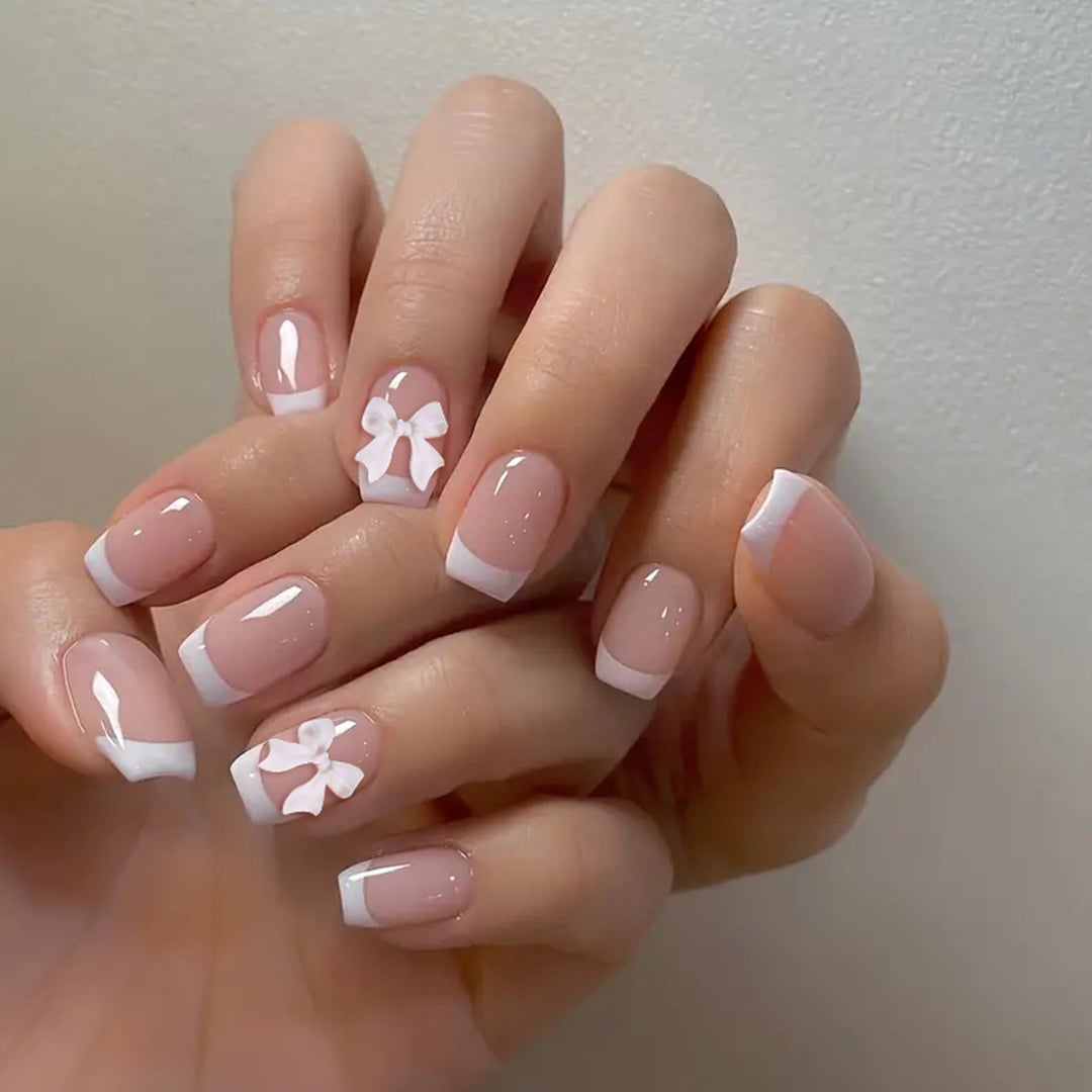 Elegant French Tip Nail Art with Bow Embellishments Kalsten