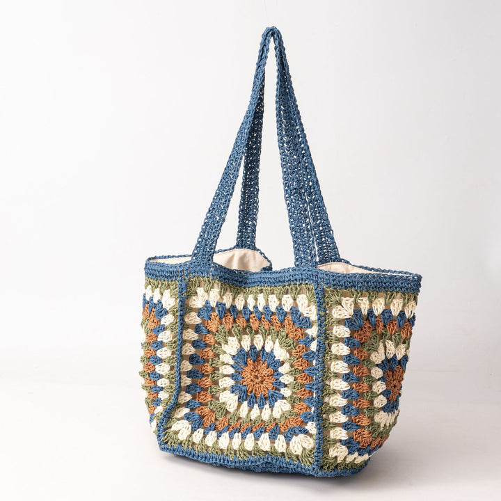 Beach bag made of hand-woven natural material with a square pattern Kalsten