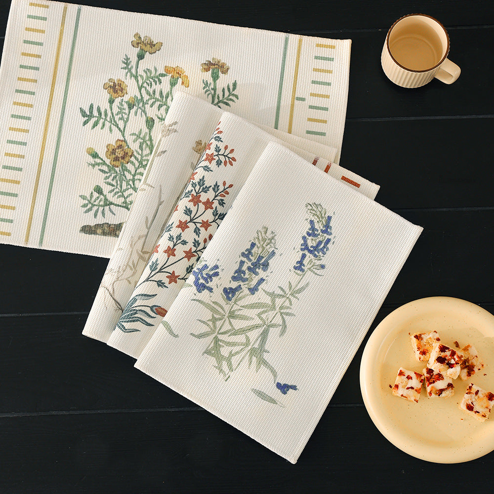 Woven placemat with botanical wildflower print and non-slip backing