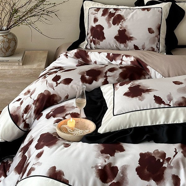 Luxury bed cover set made of cotton satin with abstract watercolor flower print and contrasting ruffle