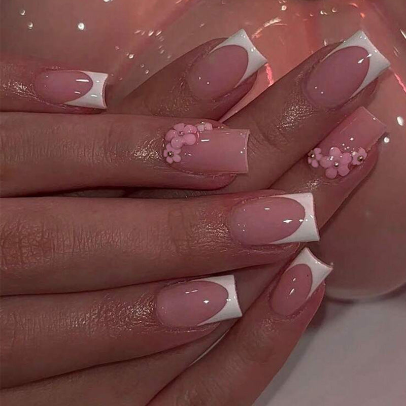 Acrylic nail set with elegant French tips and decorative accents Kalsten