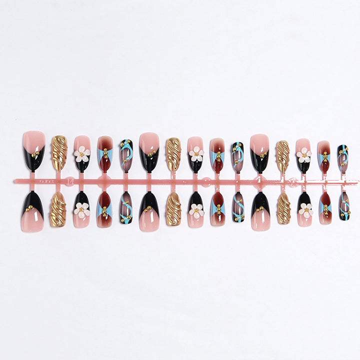 Artificial nail set with filigree floral decorations and glamorous accents Kalsten