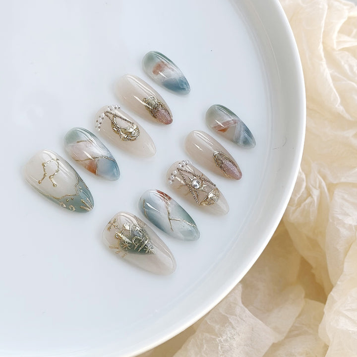 Artistic Press-On Nail Art Set with Celestial and Gem Accents