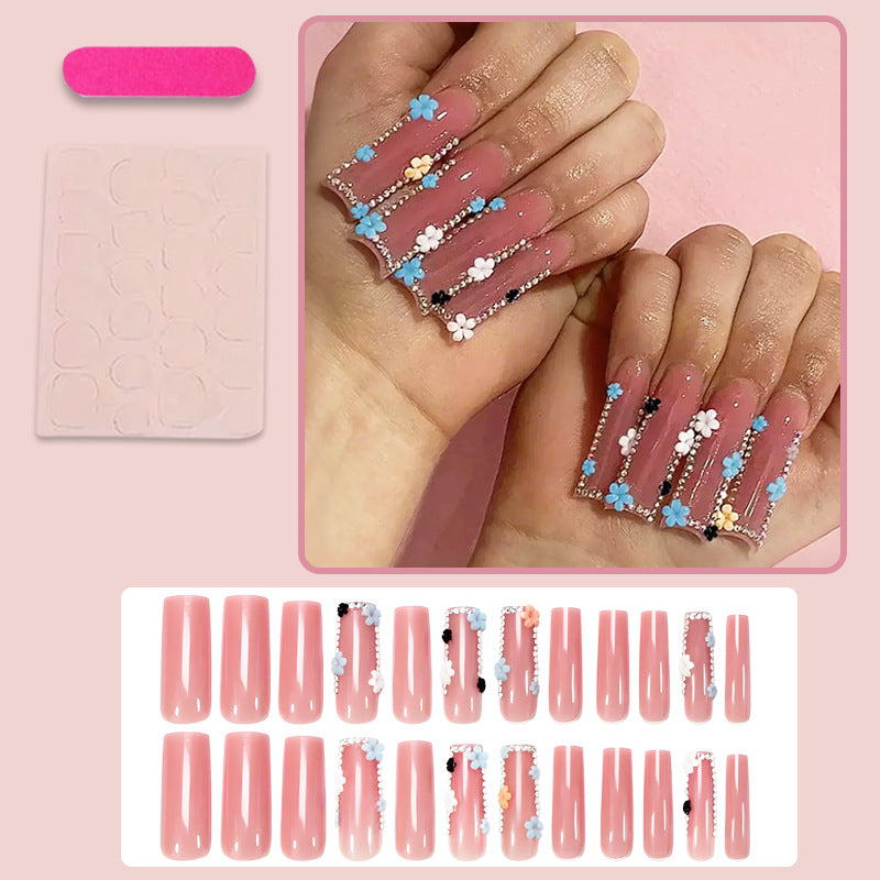 Artificial nail art set with floral decorations and glitter accents Kalsten