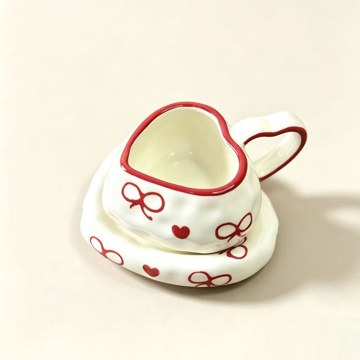 Heart-shaped ceramic cup set with saucer