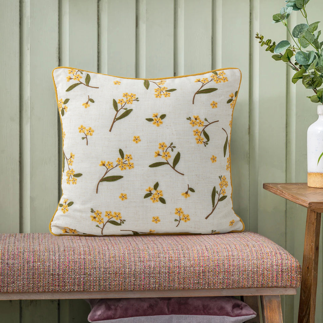 Decorative embroidered cushion cover made of linen blend with floral yellow flower appliqué and piping Kalsten