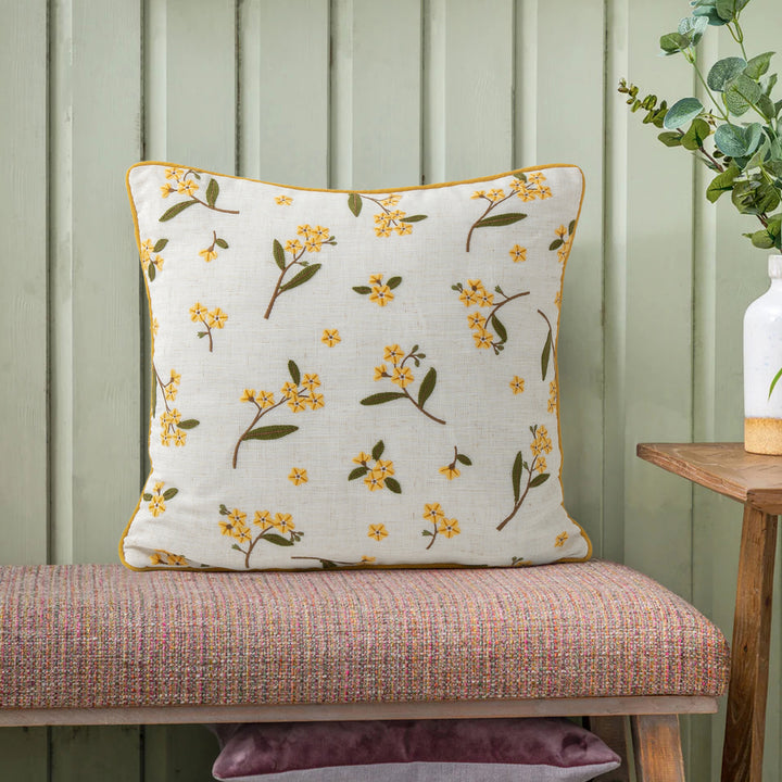 Decorative embroidered cushion cover made of linen blend with floral yellow flower appliqué and piping Kalsten