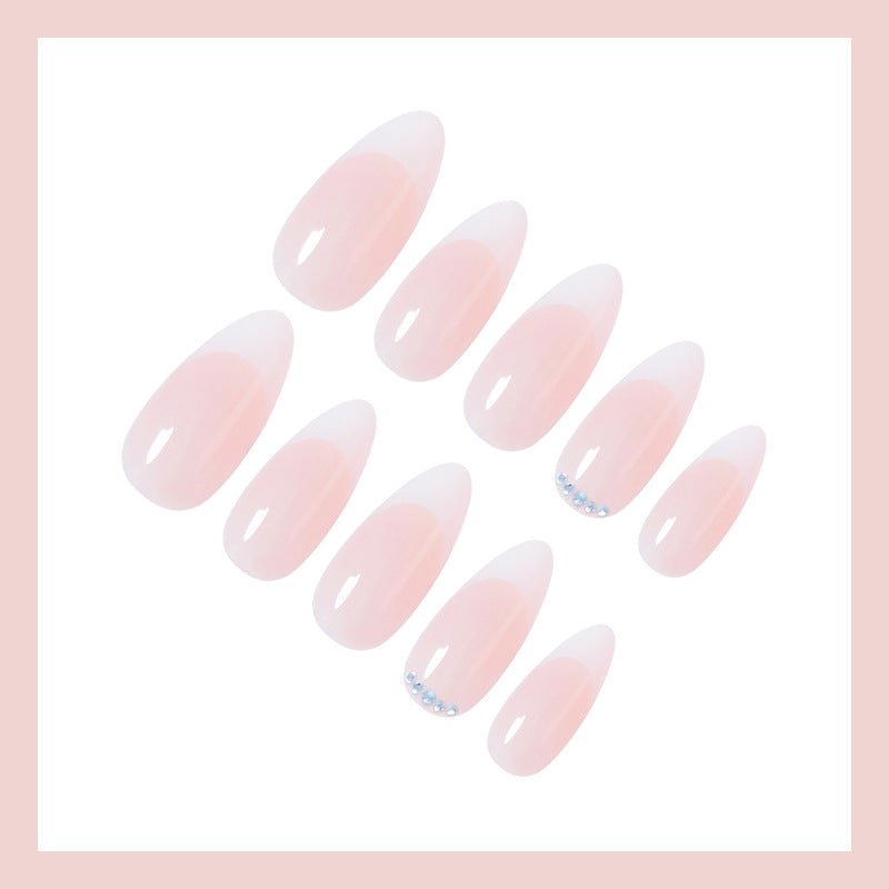 Artificial nail set with elegant French tip look and shimmering accents Kalsten